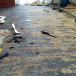 Stripping the tar from the demolished kitchen